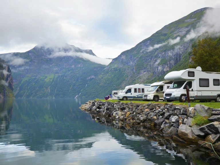 A line up of camper vans, trailers and caravans ready for electrical repairs