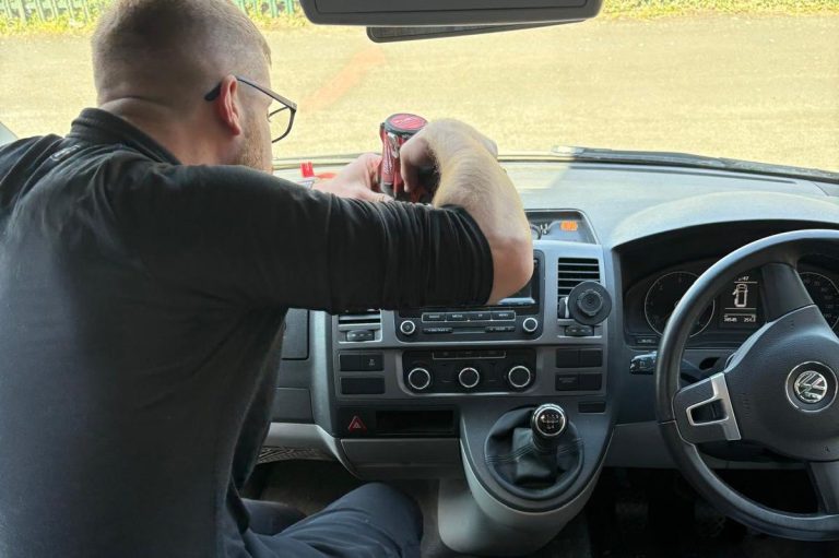 Auto electrical Technician installing a carplay radio into a VW Transporteer T5.1